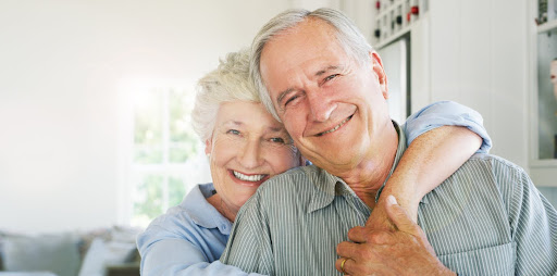 Shot of a happy senior couple in a loving embrace at home